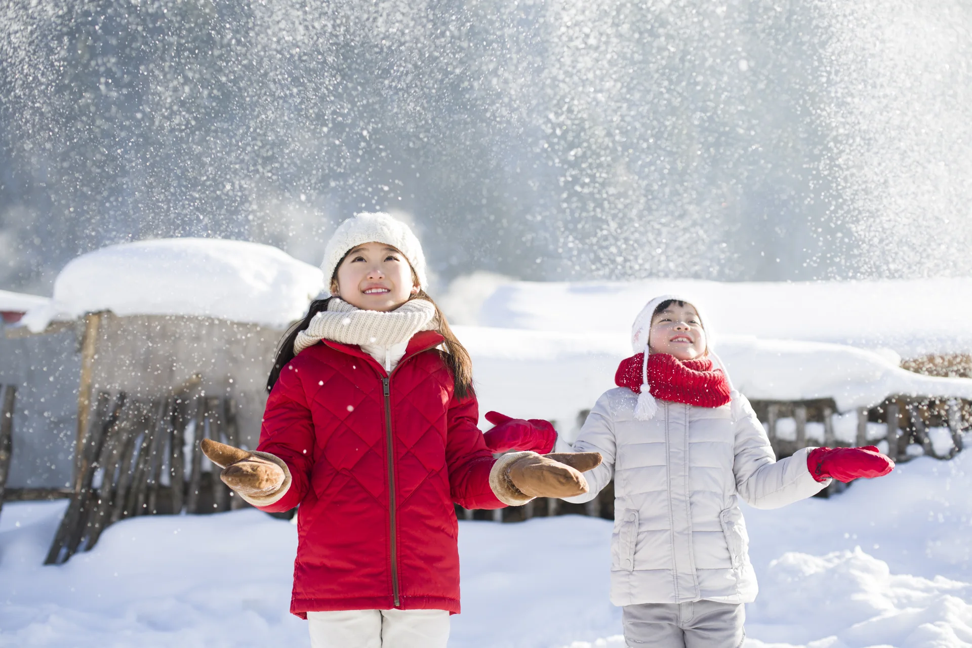 Children playing outdoors in snow